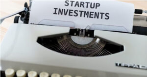 Startup fundraising fundamentals represented by a typewriter displaying startup investments