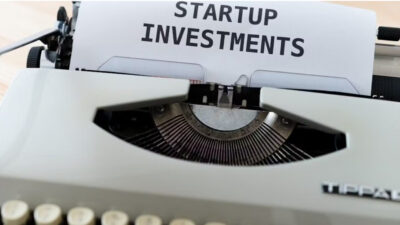 Startup fundraising fundamentals represented by a typewriter displaying startup investments